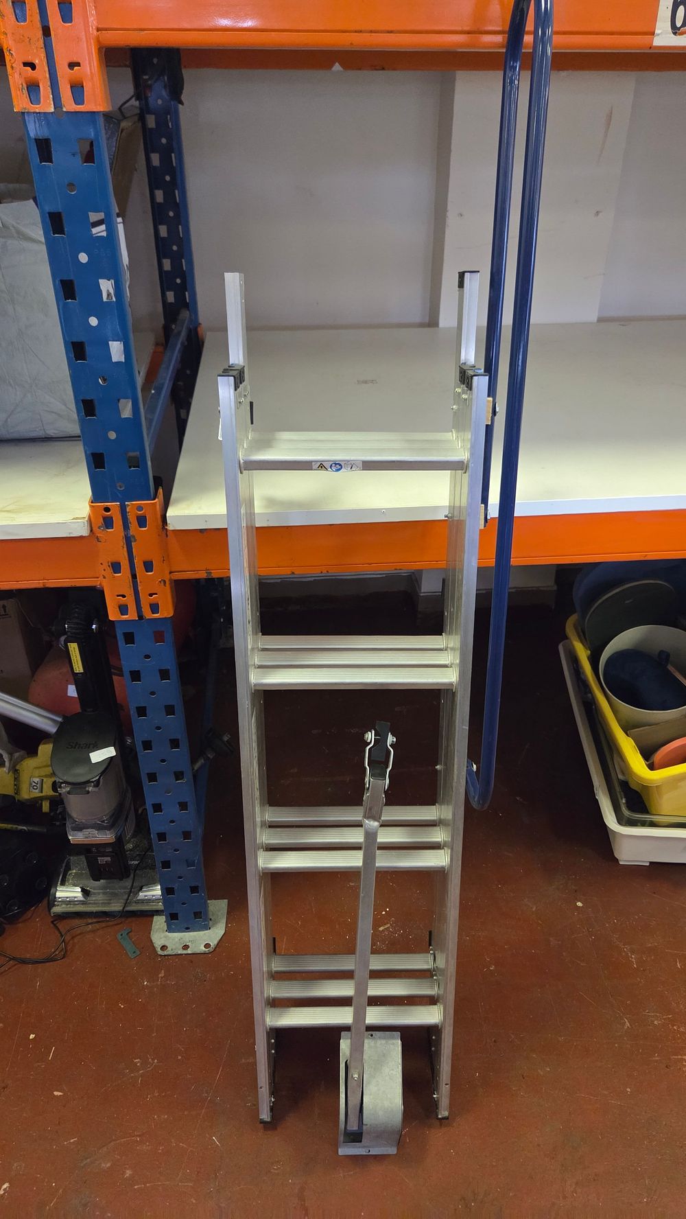 Lot 284 – An Aluminium Three-Section Sliding Loft Ladder with Mounting Bracket