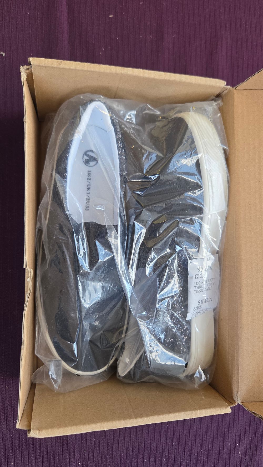 Lot 205 – A Pair of New Black Glitter Slip-on Shoes Size 2