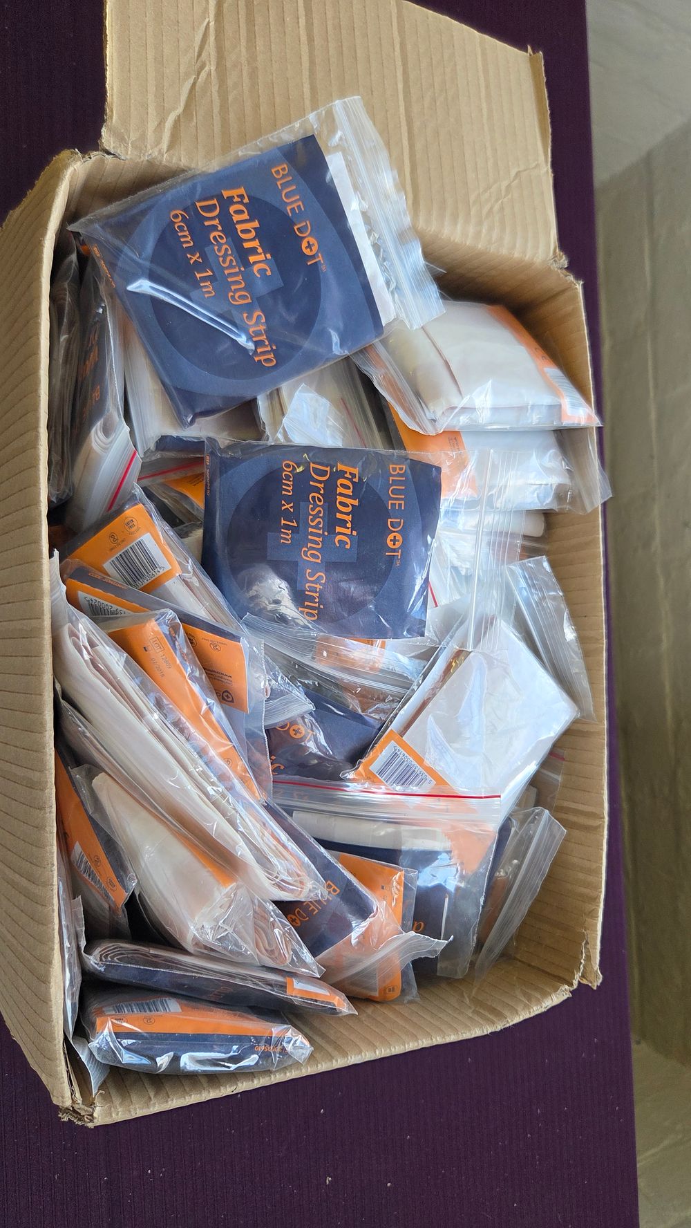 Lot 211 – A Box of Blue Dot Fabric Dressing Strips