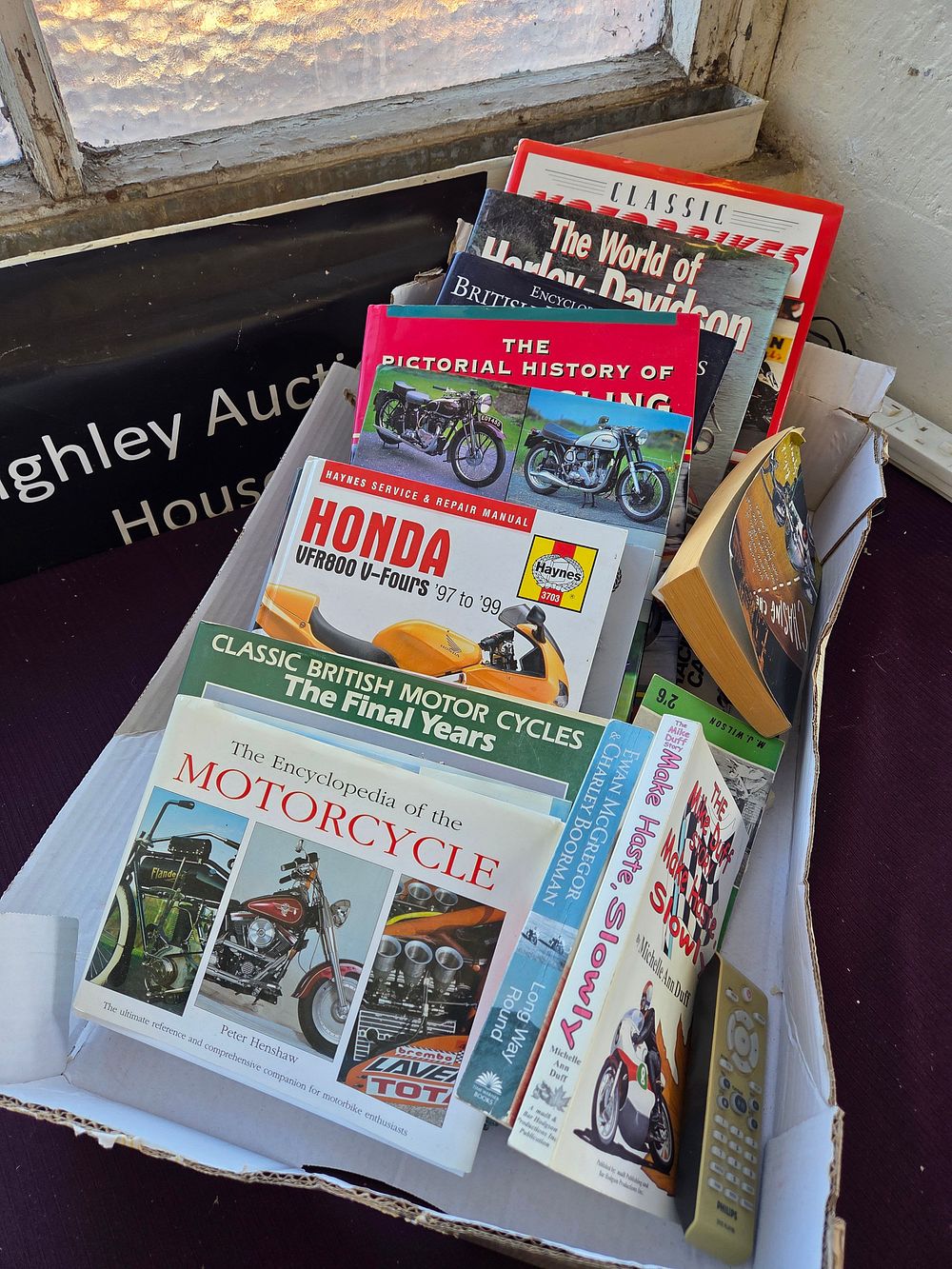 Lot 354 – A Collection of Motorcycling Books and Manuals including Henshaw, Duff, and Haynes