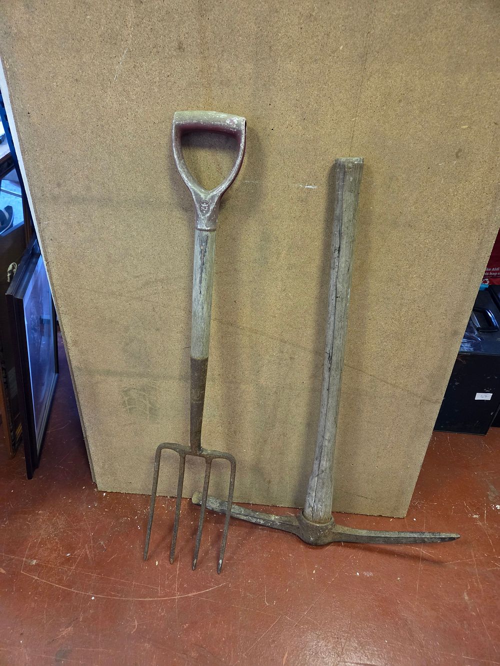 Lot 381 – Two Vintage Manual Labour Tools comprising a Spear and Jackson Garden Fork and a Pickaxe