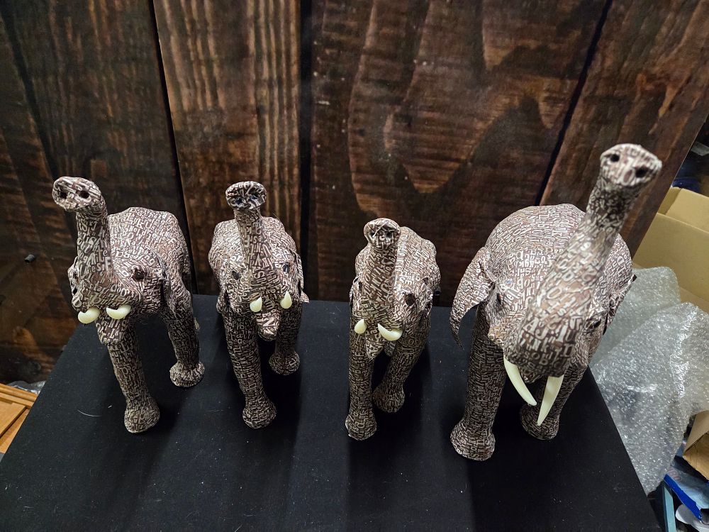 Lot 625 – A Set of Contemporary Typographical Decoupage Elephant Figurines