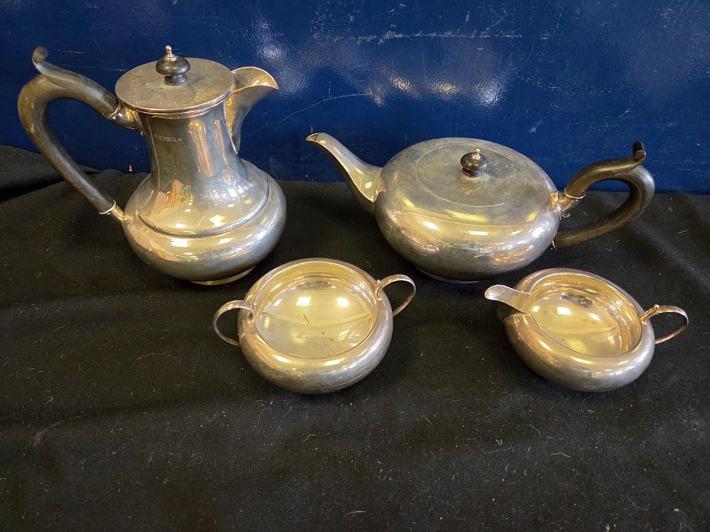 Lot 168 – A George V Four-Piece Sterling Silver Tea and Coffee Service by Joseph Gloster Ltd. 1397 grams