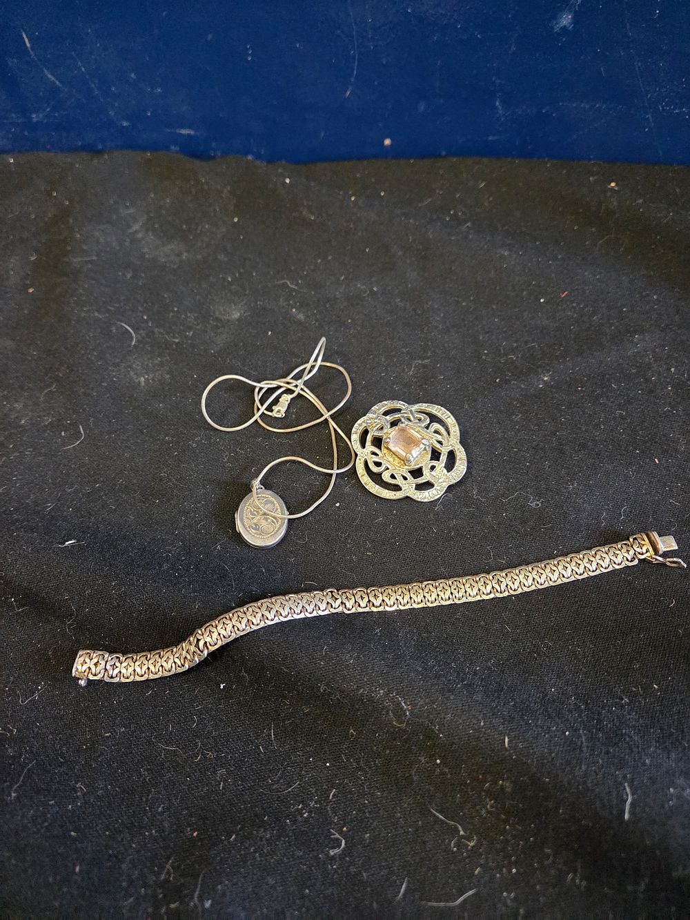 Lot 186 – A Trio of Jewellery including a Sterling Silver Celtic Style Brooch and Locket 36.5 grams