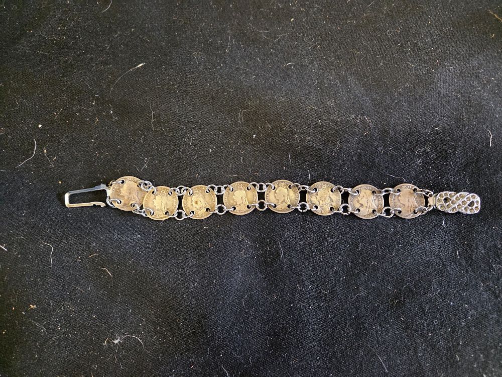 Lot 187 – A Late Victorian Silver Threepence Coin Link Bracelet with Marcasite Accents