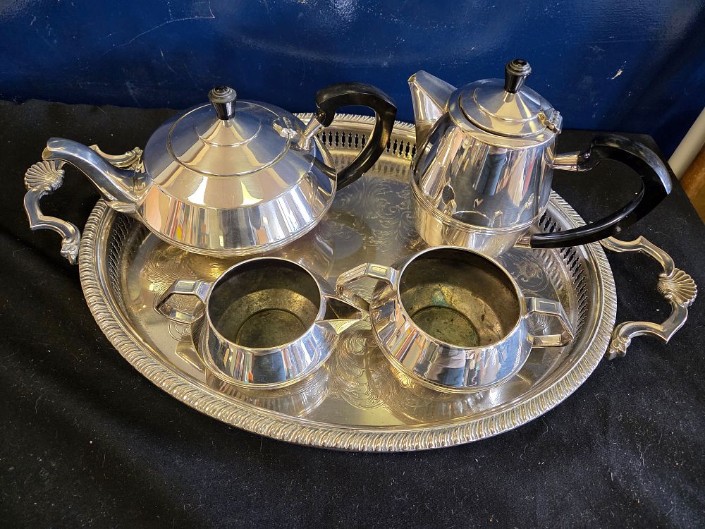 Lot 194 – An Art Deco Style Silver Plated Tea and Coffee Service with an Oval Gallery Tray