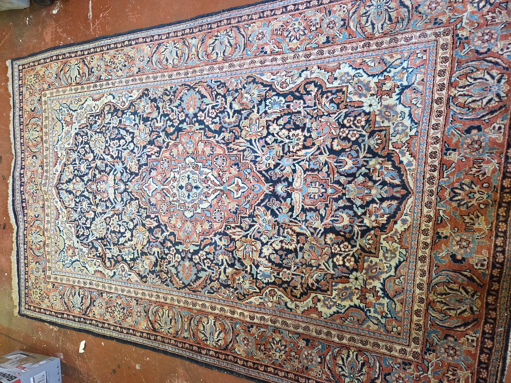 Lot 228 – A 1920’s Persian Kashan style wool pile rug with central medallion