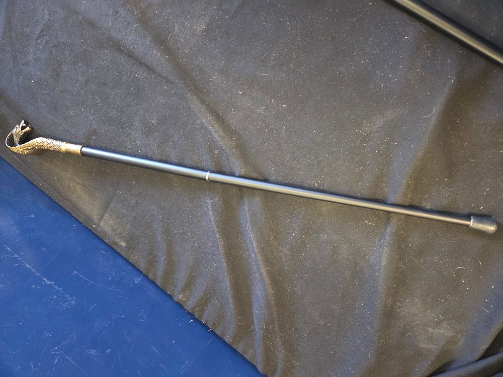 Lot 234 – A contemporary decorative walking cane with cast metal cobra handle