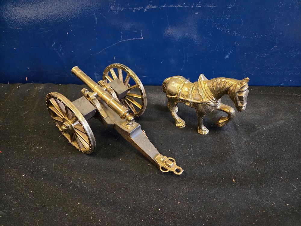 Lot 241 – Two decorative vintage brass models comprising an 18th-century style field cannon and a heavy horse figurine