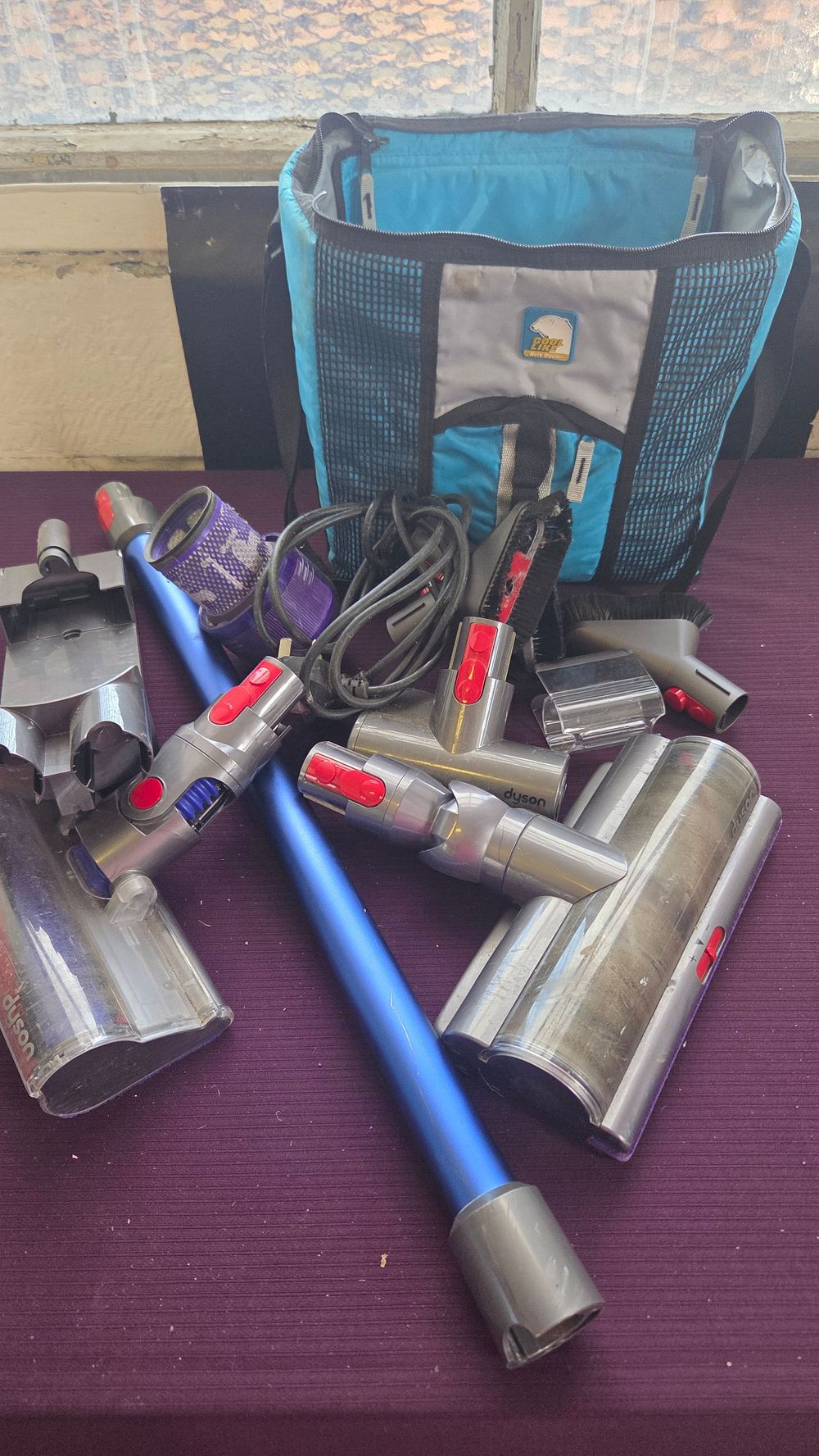 Lot 244 – An Assortment of Dyson Cordless Vacuum Cleaner Accessories and Components
