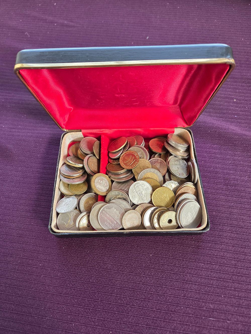 Lot 601 – A Collection of International Coins from DE, ES, NL, FR, and TW in a Presentation Case