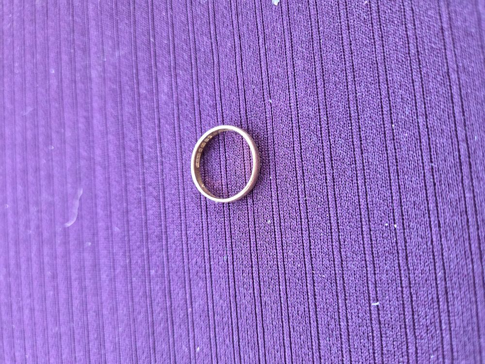 Lot 630 – A 22ct yellow gold D-shape wedding band by Charles Green and Son Ltd 1976 2.528 grams
