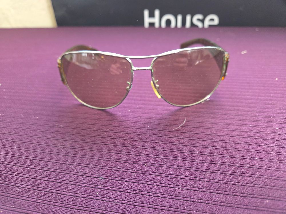 Lot 641 – A pair of Prada silver-toned and tortoiseshell sunglasses