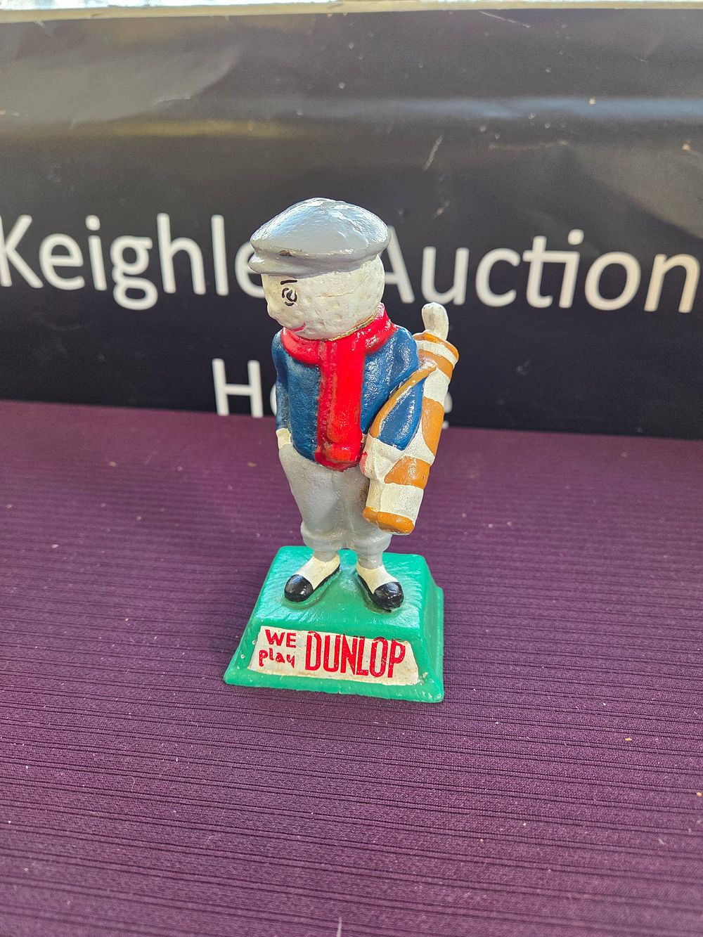 Lot 246 – A Cast Iron Dunlop Golf Man Advertising Figurine