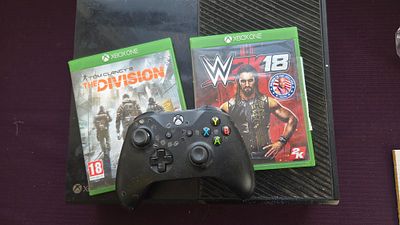 A Microsoft Xbox One Console, Controller, and Games