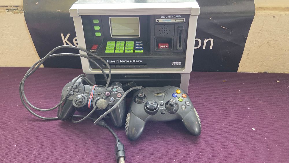 Lot 166 – Science Museum ATM Bank and Two Gaming Controllers