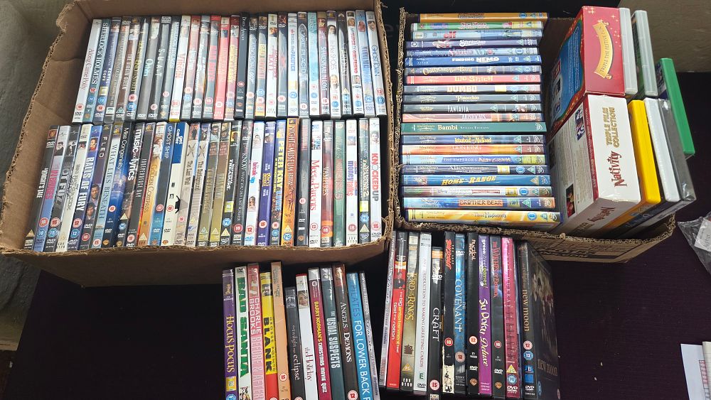 Lot 273 – Two Boxes of DVD and Blu-ray Discs Including Disney Animated Classics and Feature Films