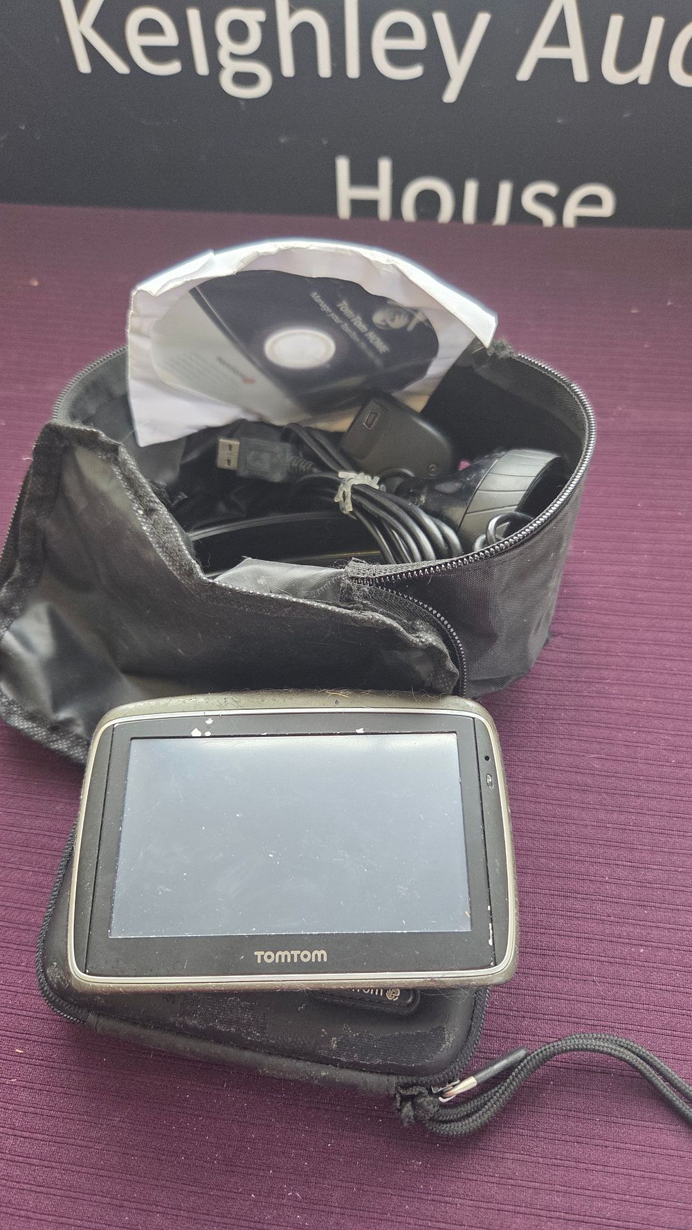 Lot 313 – A TomTom Portable GPS Satellite Navigation System and an Assortment of Accessories