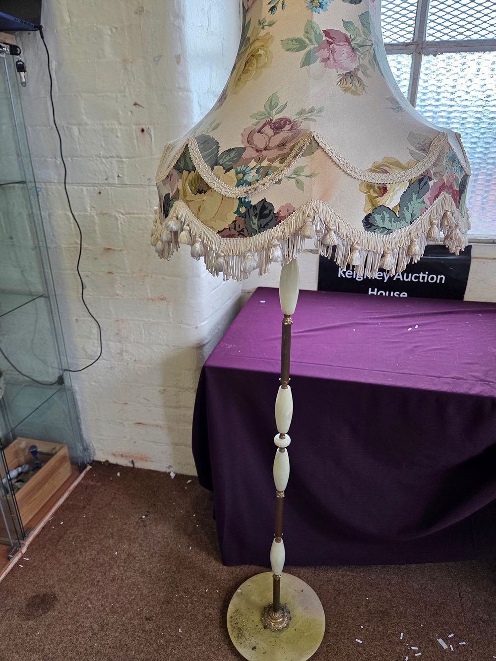 Lot 373 – A mid-20th century onyx and brass-toned metal floor lamp with floral fabric shade