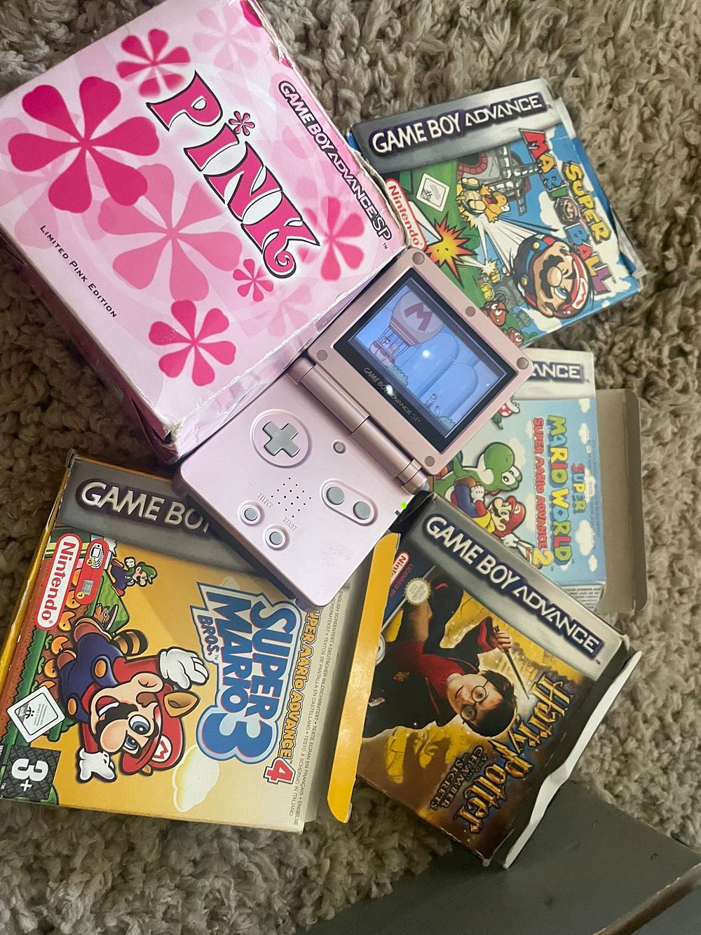 Lot 398 – A Collection of Nintendo Game Boy Advance SP Pearl Pink Limited Edition Console and Boxed Games