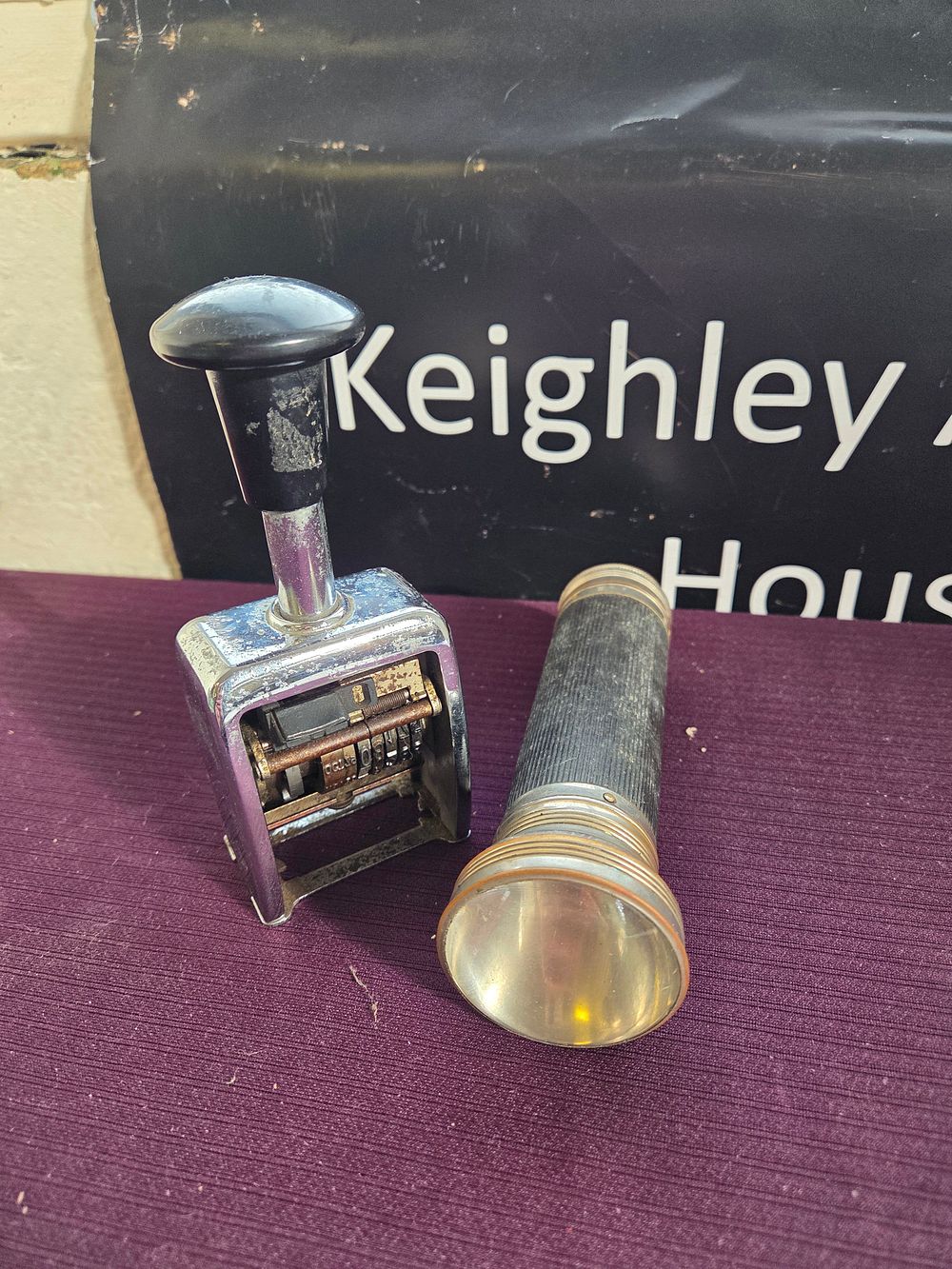 Lot 613 – Two Vintage Utility Objects comprising a Flashlight and a Mechanical Date Stamp