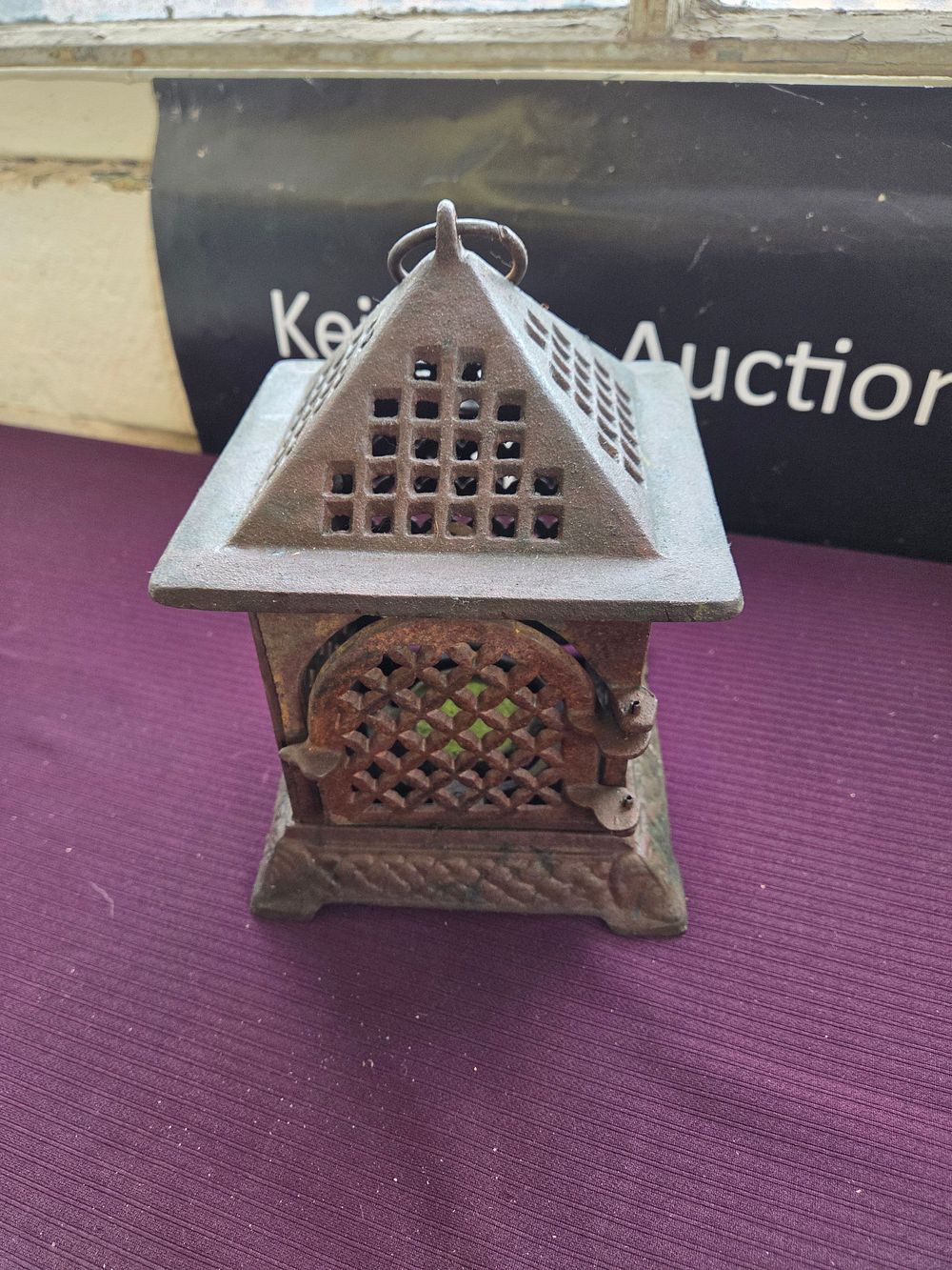 Lot 621 – A 20th century cast iron pagoda-form garden lantern