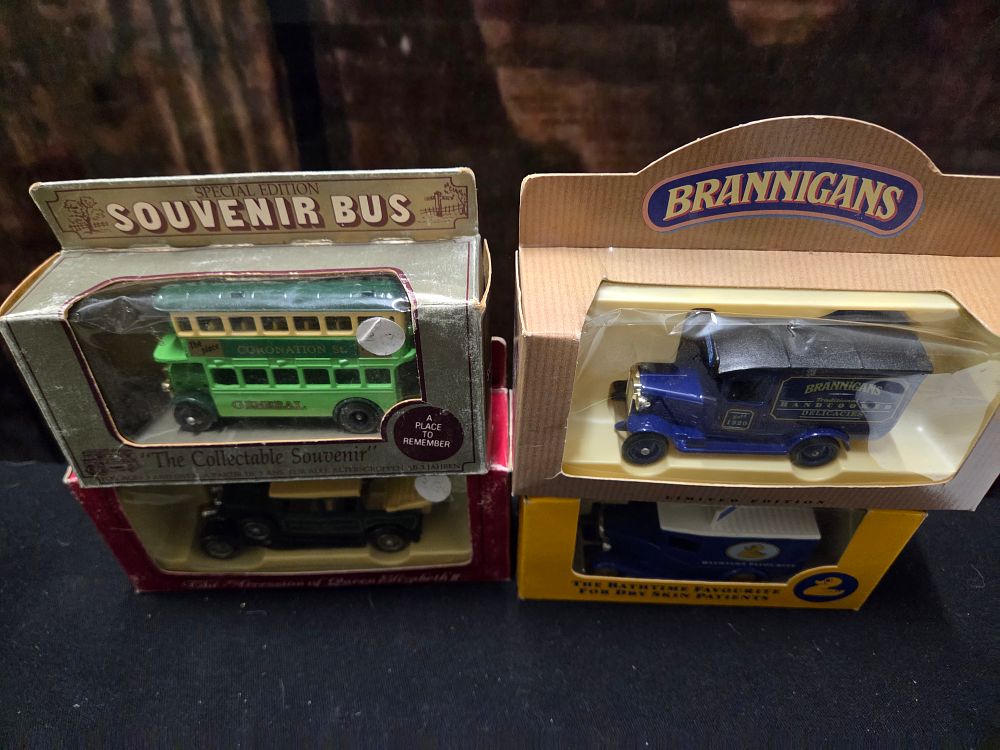 Lot 643 – A Collection of Four Boxed Die-Cast Model Vehicles