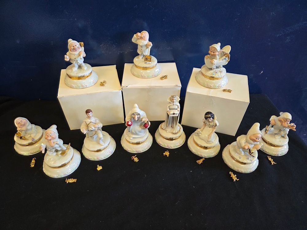 Lot 651 – A collection of eleven Lenox Disney Snow White and the Seven Dwarfs porcelain treasure boxes