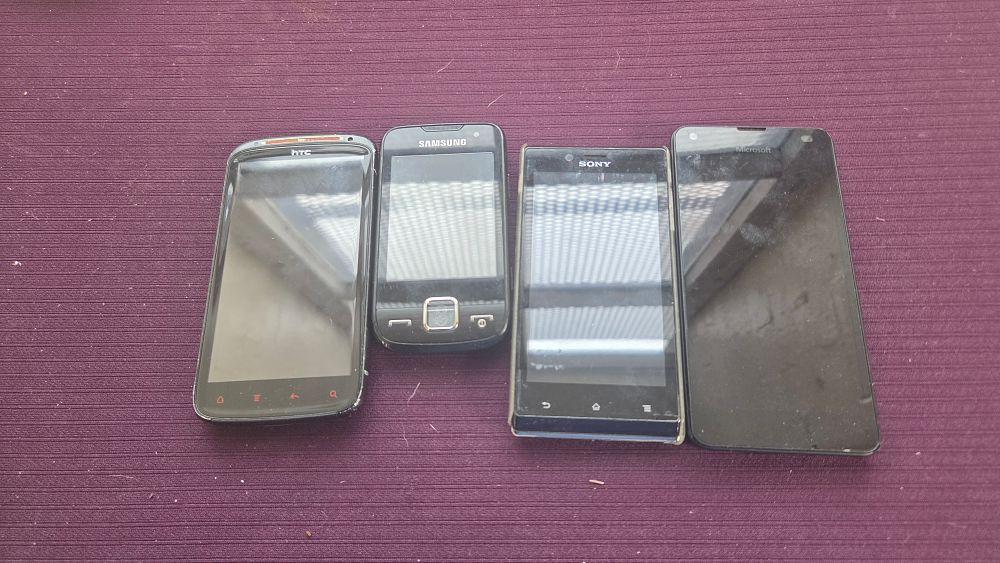 Lot 184 – A Collection of Four Mobile Handsets including HTC, Samsung, Sony, and Microsoft Models