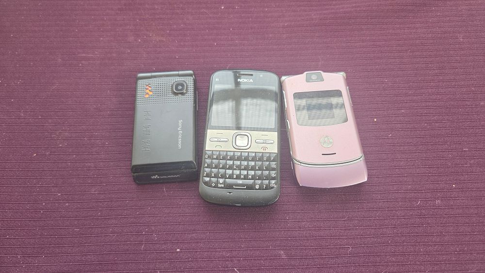 Lot 185 – A Trio of Vintage Mobile Telephones including Nokia E5-00, Motorola Razr V3, and Sony Ericsson Walkman