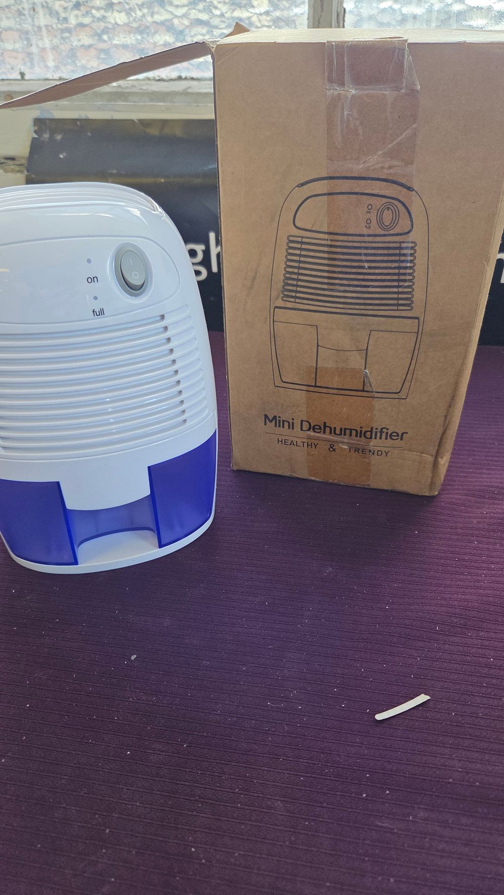 Lot 295 – A New Portable Mini Electric Dehumidifier with Original Packaging
