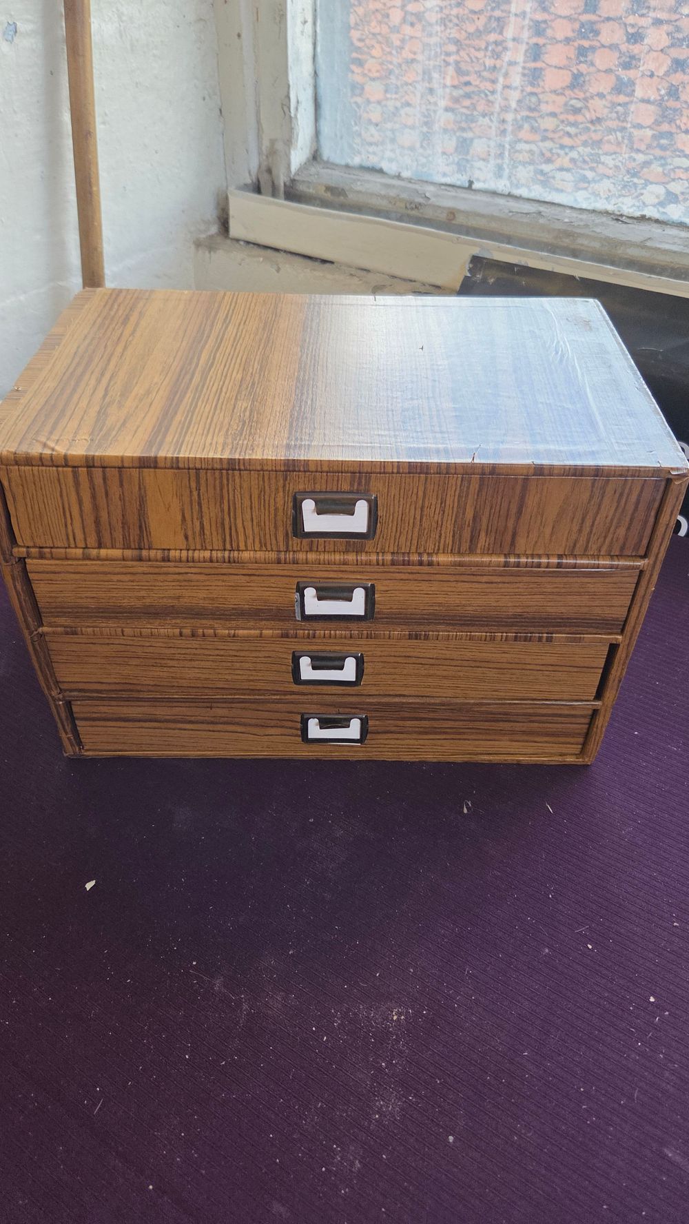 Lot 320 – A mid-20th-century desktop document organiser with wood-effect laminate finish
