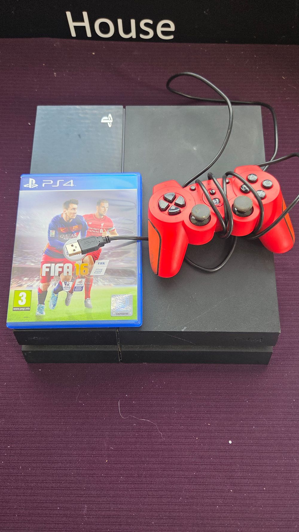 Lot 169 – Sony PlayStation 4 console, Wired controller and Game powers on