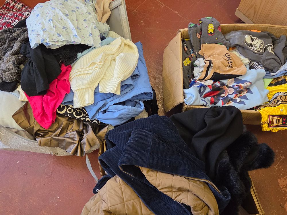 Lot 444 – An Assortment of Children’s and Adult Apparel Including Outerwear and Casual Pieces