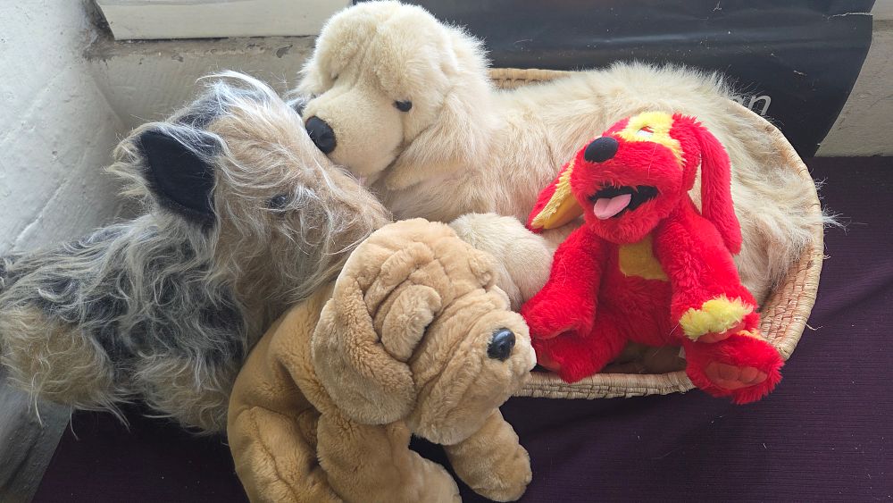 Lot 152 – A Collection of Assorted Plush Soft Toy Dogs with Wicker Basket