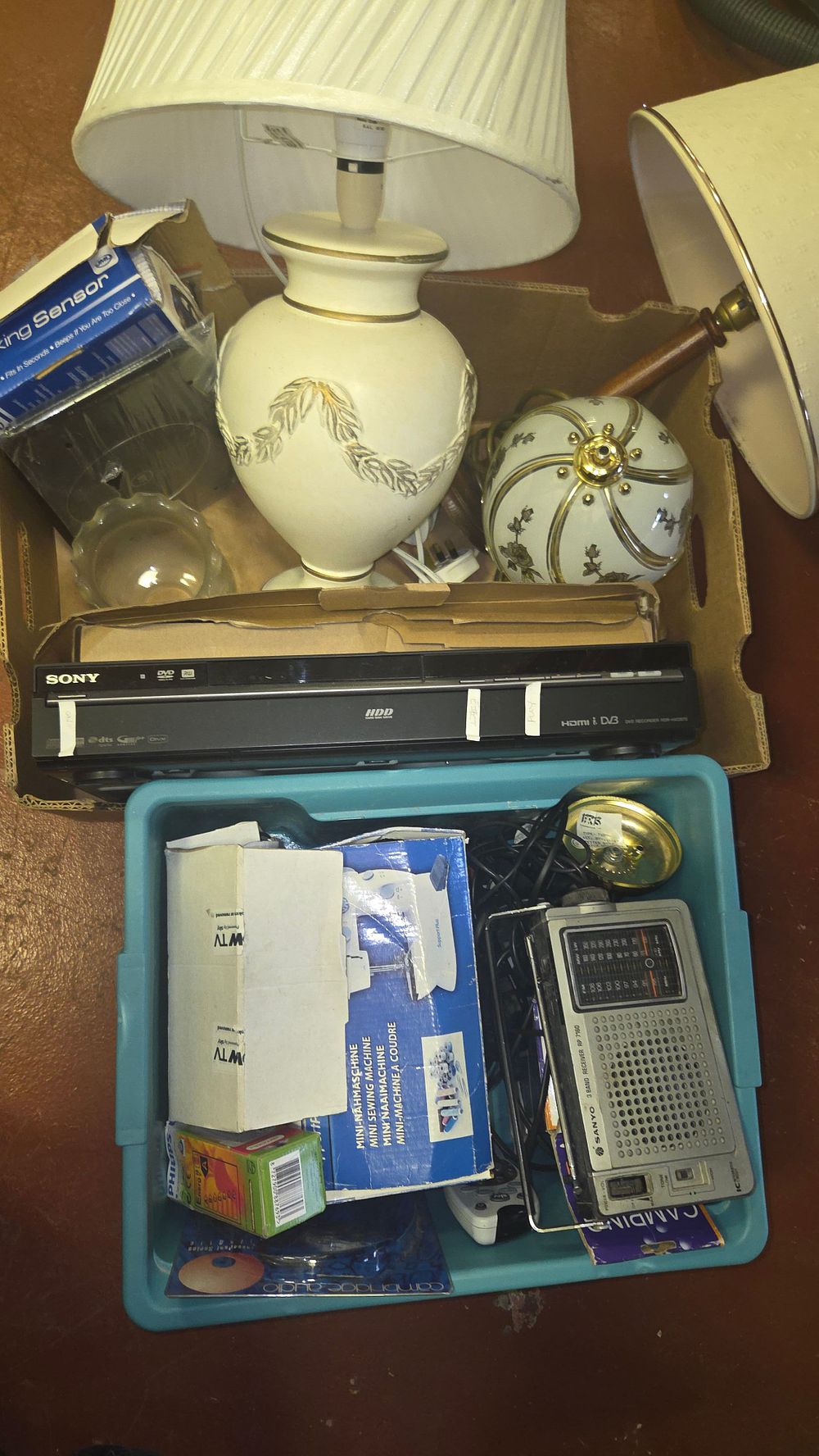 Lot 172 – Two Boxes of Domestic Electronics and Decorative Household Items including Sony and Sanyo Equipment