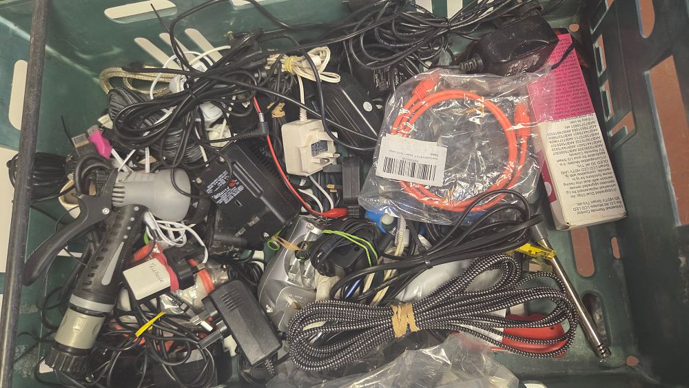 Lot 258 – An Assortment of Electronic Cables, Power Adapters, and Miscellaneous Accessories
