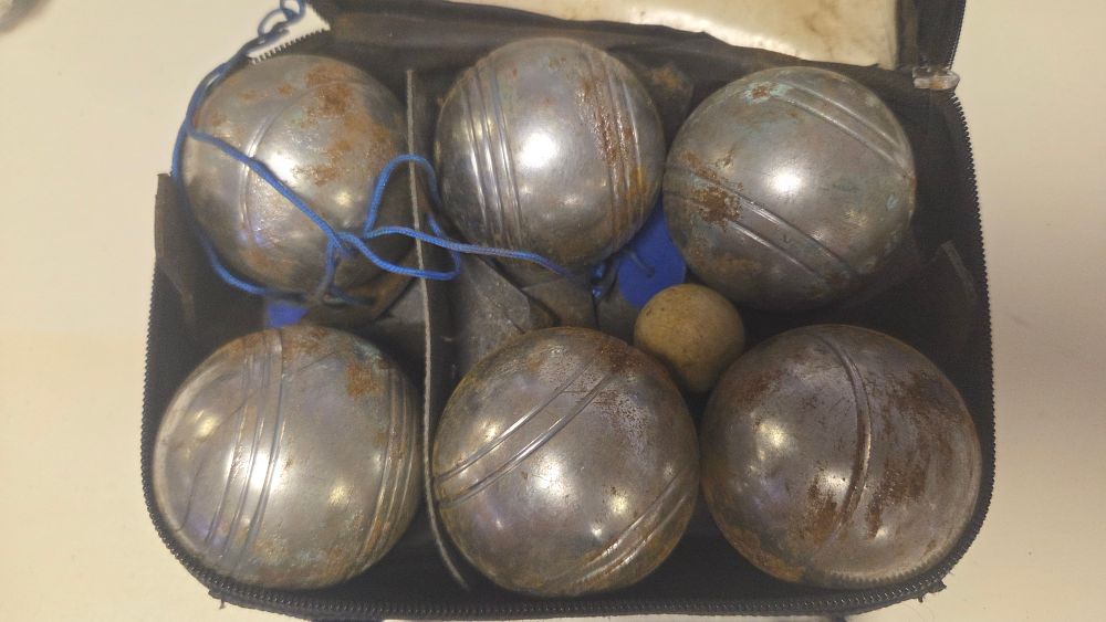 Lot 262 – A Set of Vintage Metal Petanque Boules with a Carrying Case