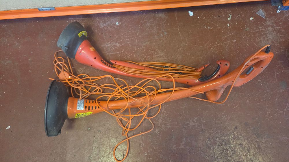Lot 213 – A Pair of Black & Decker Style Corded Electric Grass Trimmers