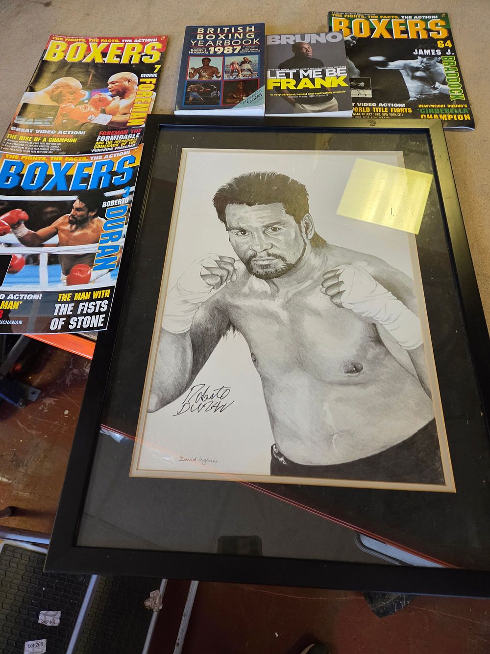 Lot 301 – A Collection of Boxing Memorabilia Including a Signed Roberto Duran Portrait and Various Publications