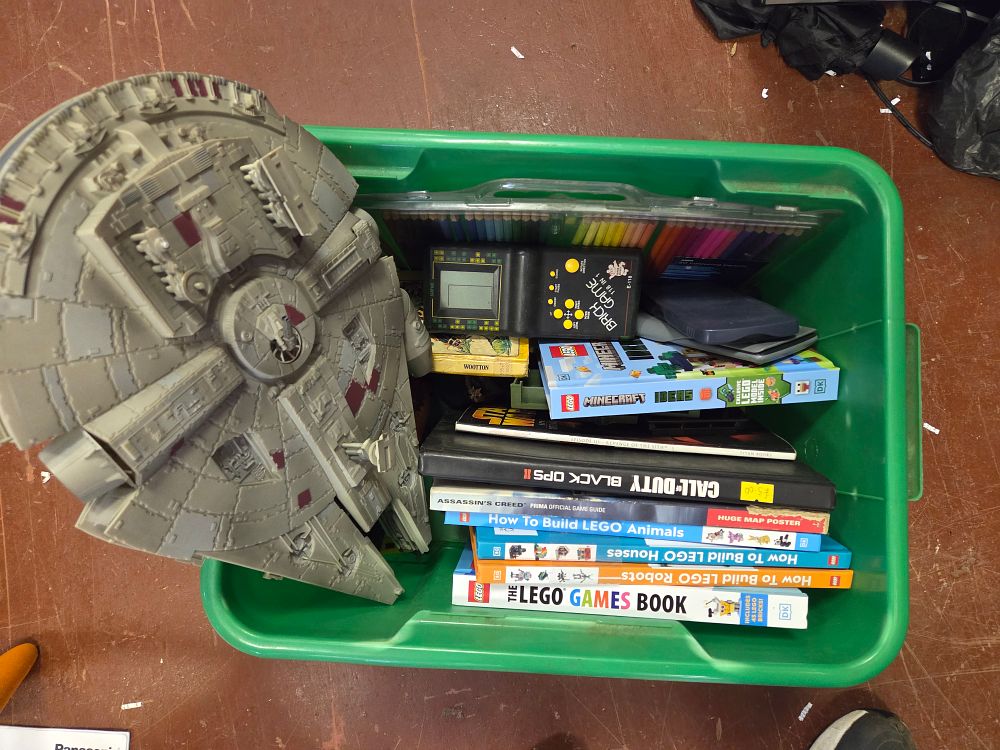 Lot 321 – An Assortment of Star Wars Toys, LEGO Books, and Handheld Electronics