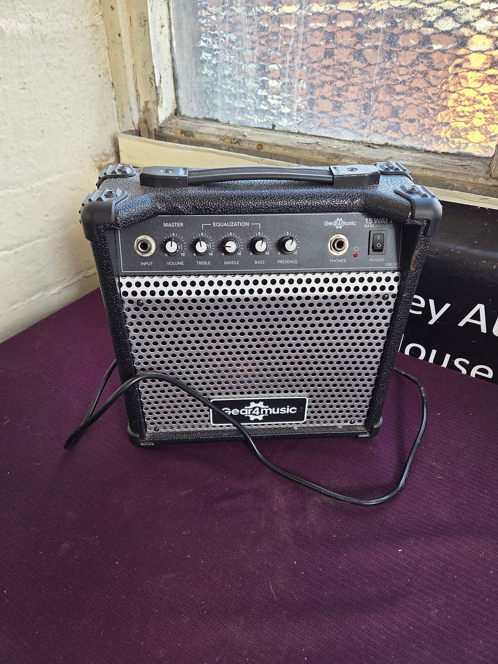Lot 345 – A Gear4music BP15 15-Watt Bass Guitar Practice Amplifier powers on