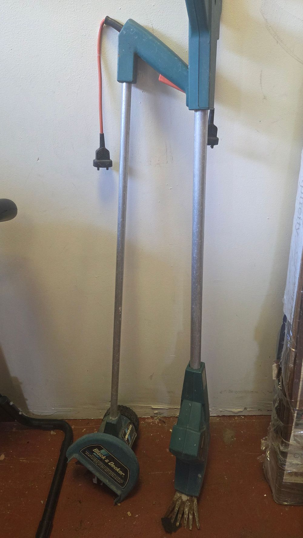 Lot 372 – Two Electric Long-Reach Garden Tools including a Black and Decker Lawn Edger