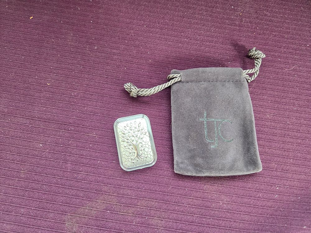 Lot 609 – A 999 White Platinum Tree of Life Bar by TJC