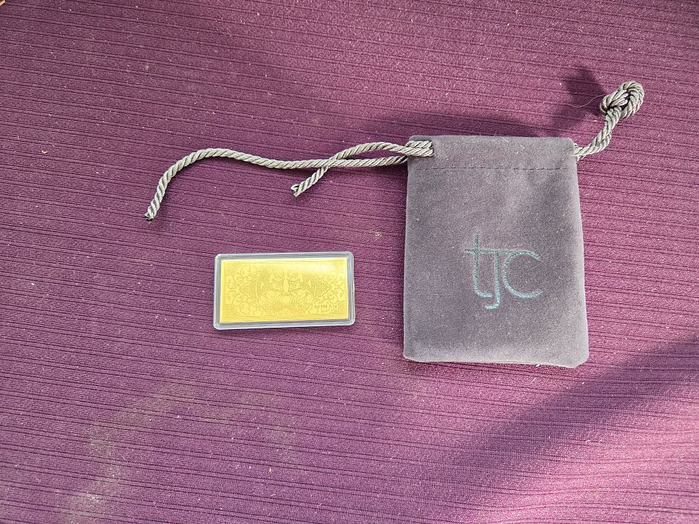 Lot 610 – A 24k Gold Pi Xiu Bullion Bar distributed by TJC