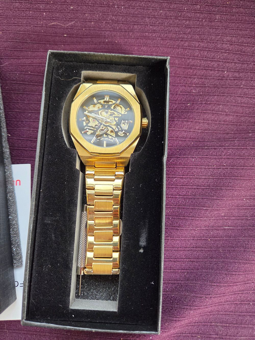 Lot 617 – A Men’s Gold-Toned Skeletonised Automatic Wristwatch in the Style of Forsining