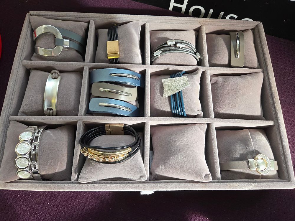 Lot 618 – A Collection of Contemporary Fashion Bracelets and Cuffs in a Velvet-Lined Display Tray