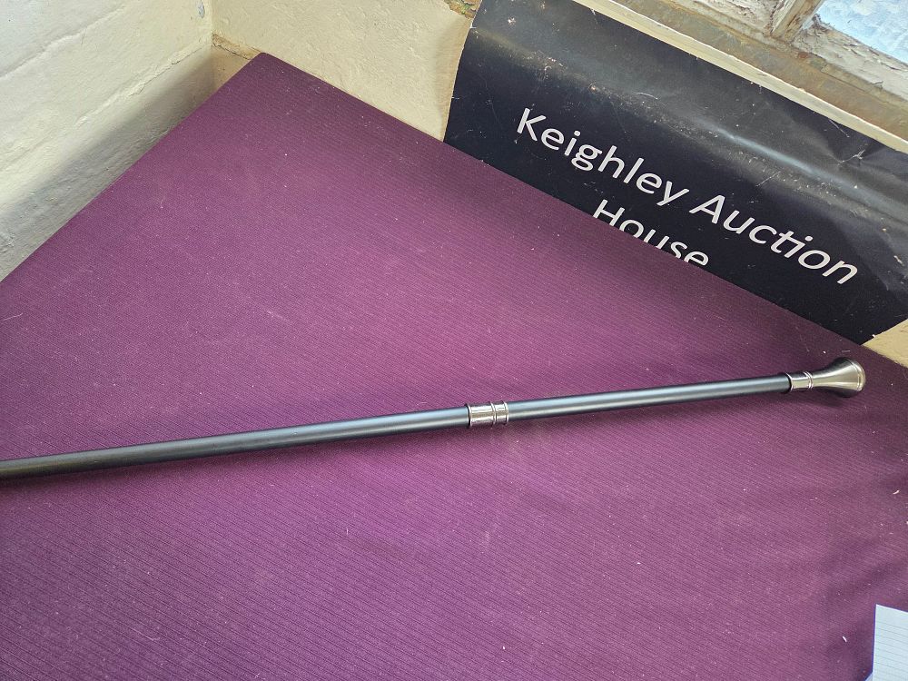 Lot 628 – A decorative Victorian style ebonised walking stick with white metal mounts