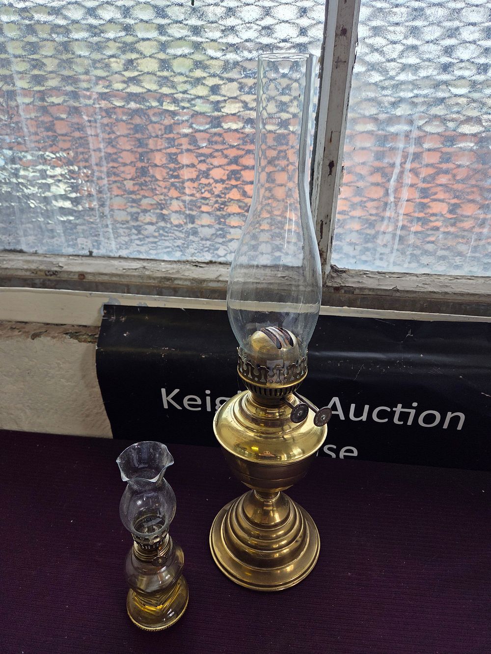 Lot 631 – Two Brass and Glass Oil Lamps