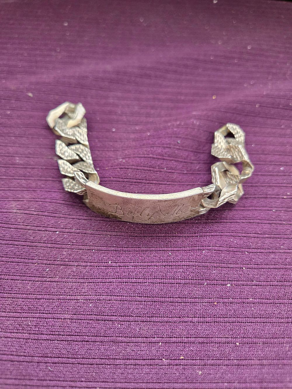 Lot 638 – A Vintage Silver 925 Identification Bracelet with Textured Curb Links 52.85g